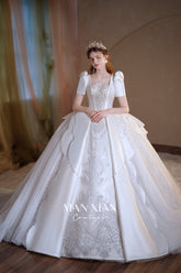 Regal Ivory Square-Neck Satin Ball Gown with Puff Sleeves, Pearl Embroidery & Oversized Bow Train m011