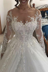 Hermosos vestidos de novia largos de tul color marfil con corte A y encaje, con mangas
