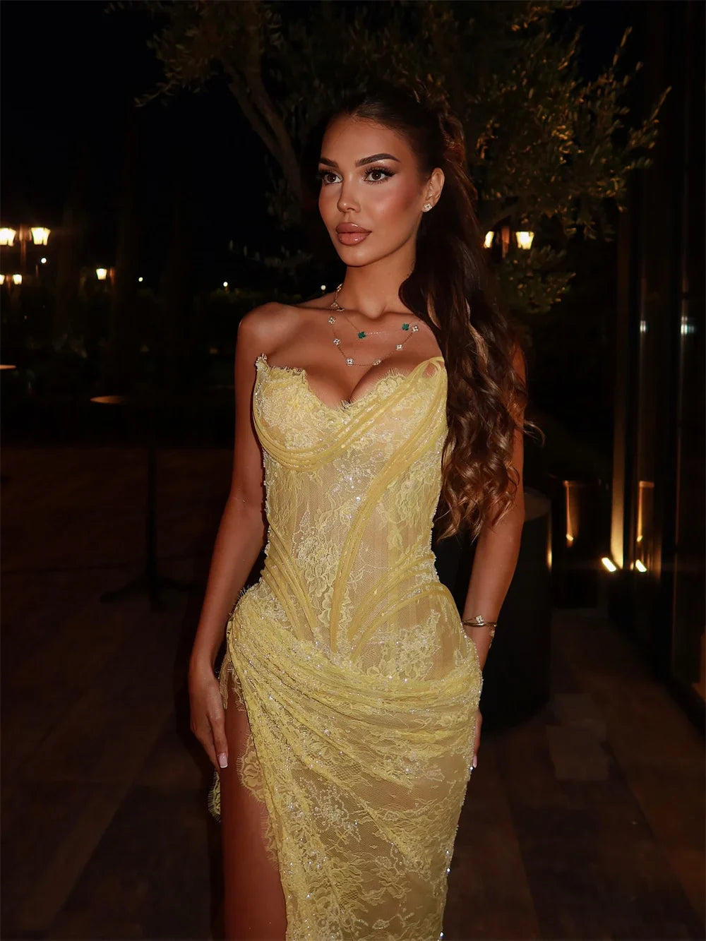 Woman in elegant yellow evening dress with lace details, ZAPDRESS evening dress collection