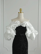 Elegant black sequin evening dress with dramatic white ruffle sleeves on mannequin, ZAPDRESS