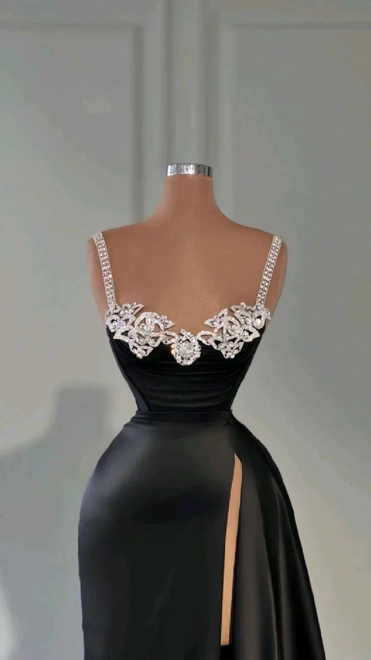 Elegant black evening gown with beaded straps and high slit, displayed on mannequin at ZAPDRESS.