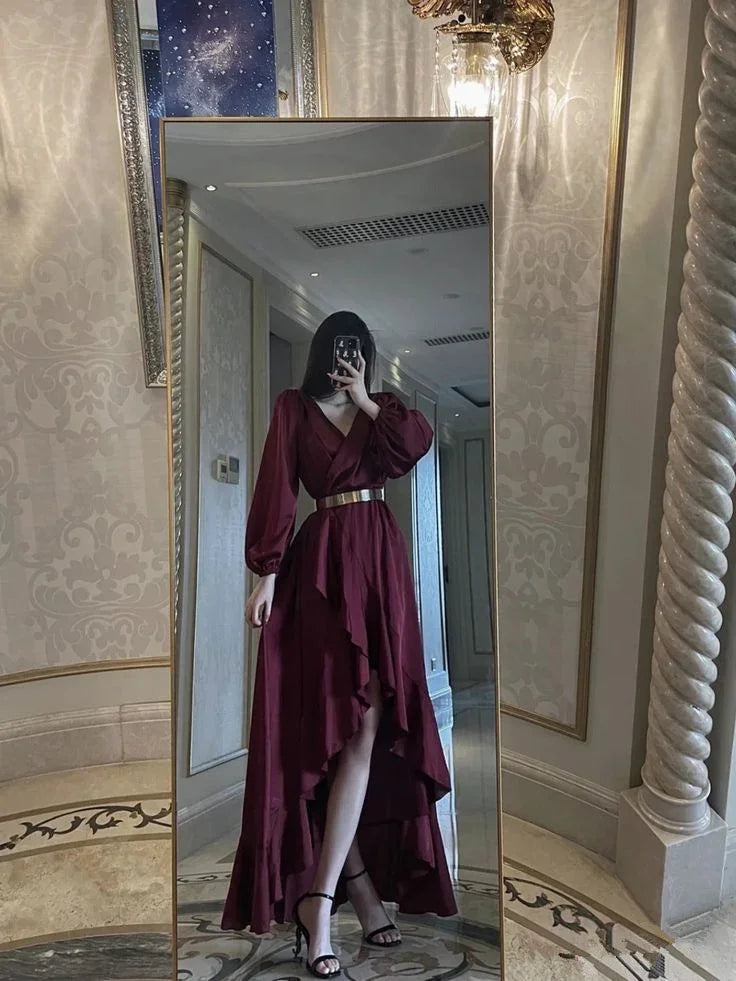 Woman in a burgundy ruffle dress with gold belt posing in a mirror, elegant ZAPDRESS style