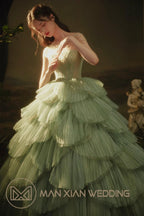 Ethereal Mint Green Tulle Ball Gown with Illusion Chain Shoulders & Tiered Ruffled Skirt by ZAPDRESS