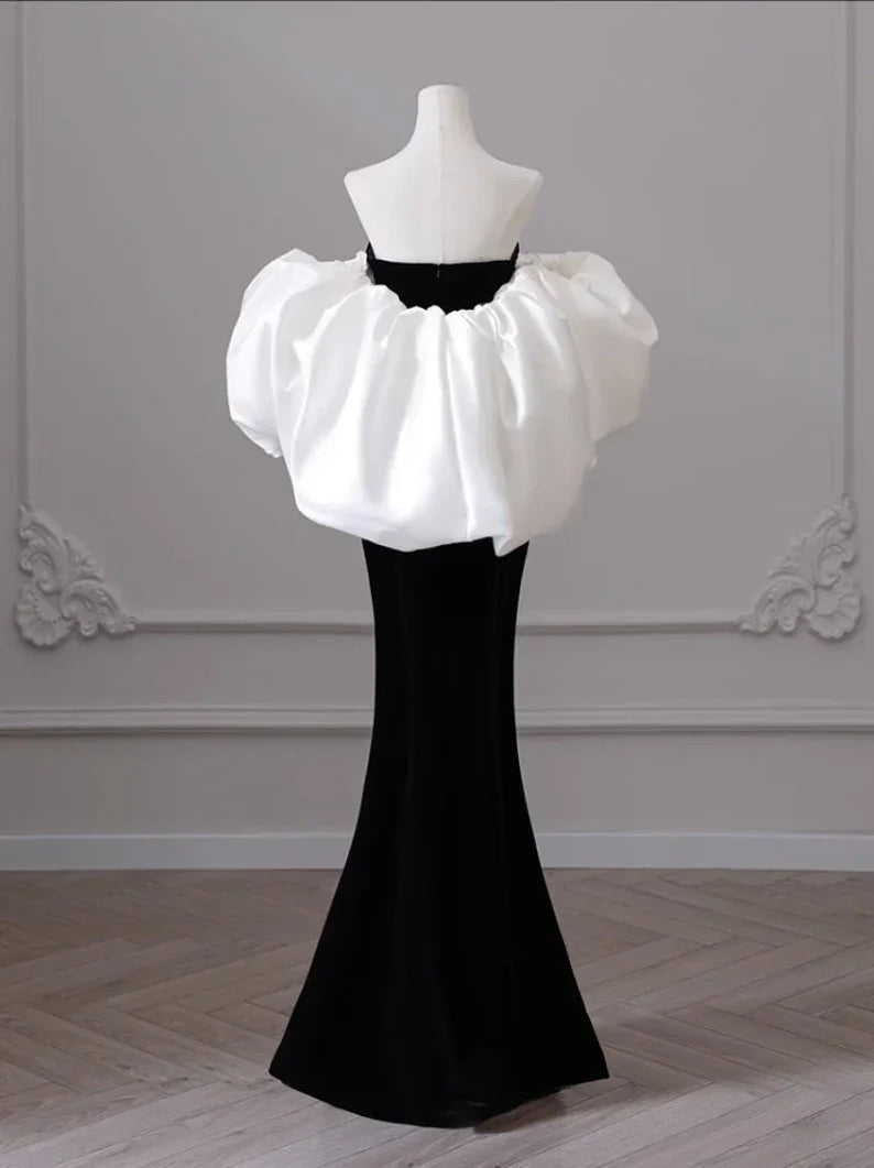 ZAPDRESS black evening gown with voluminous white ruffle detail on a mannequin