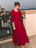 Elegant woman in long red evening gown on terrace, ZAPDRESS fashion dress style