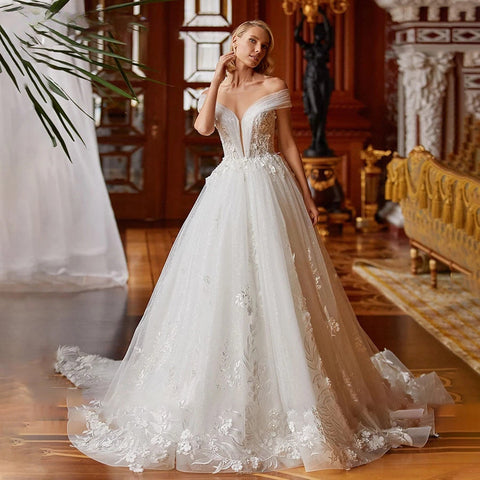 Vestido de novia romántico y sexy con escote en V 2023, corte A, largo hasta el suelo, encantador, hombros descubiertos, apliques de cuentas. 