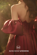 Opulent Burgundy Strapless Satin Ball Gown with Puff Sleeves & Sequin Bodice by ZAPDRESS
