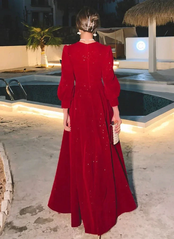 Elegant woman in a red evening gown by a pool at night, ZAPDRESS fashion style