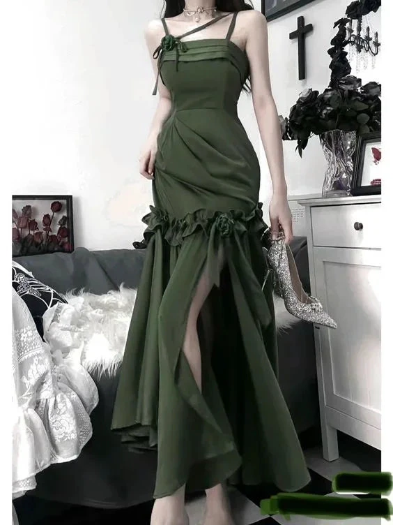 Elegant green evening dress with floral ruffle details, model holding sparkling heels, ZAPDRESS