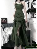 Elegant green evening dress with floral ruffle details, model holding sparkling heels, ZAPDRESS