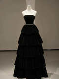 Elegant black strapless tiered velvet evening gown on mannequin at ZAPDRESS