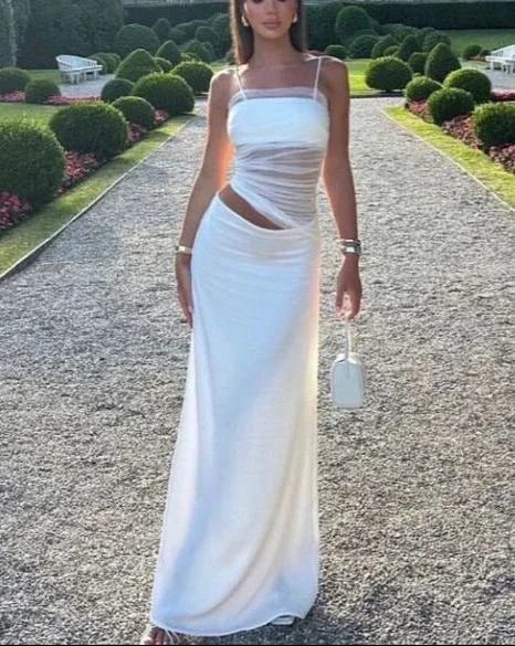 Woman in elegant white cutout maxi dress outdoors, ZAPDRESS fashion, garden setting