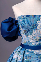 Floral blue dress on mannequin with bold satin puff sleeve, ZAPDRESS fashion design