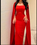 Elegant red evening gown with cape sleeves, modeled indoors, ZAPDRESS fashion collection