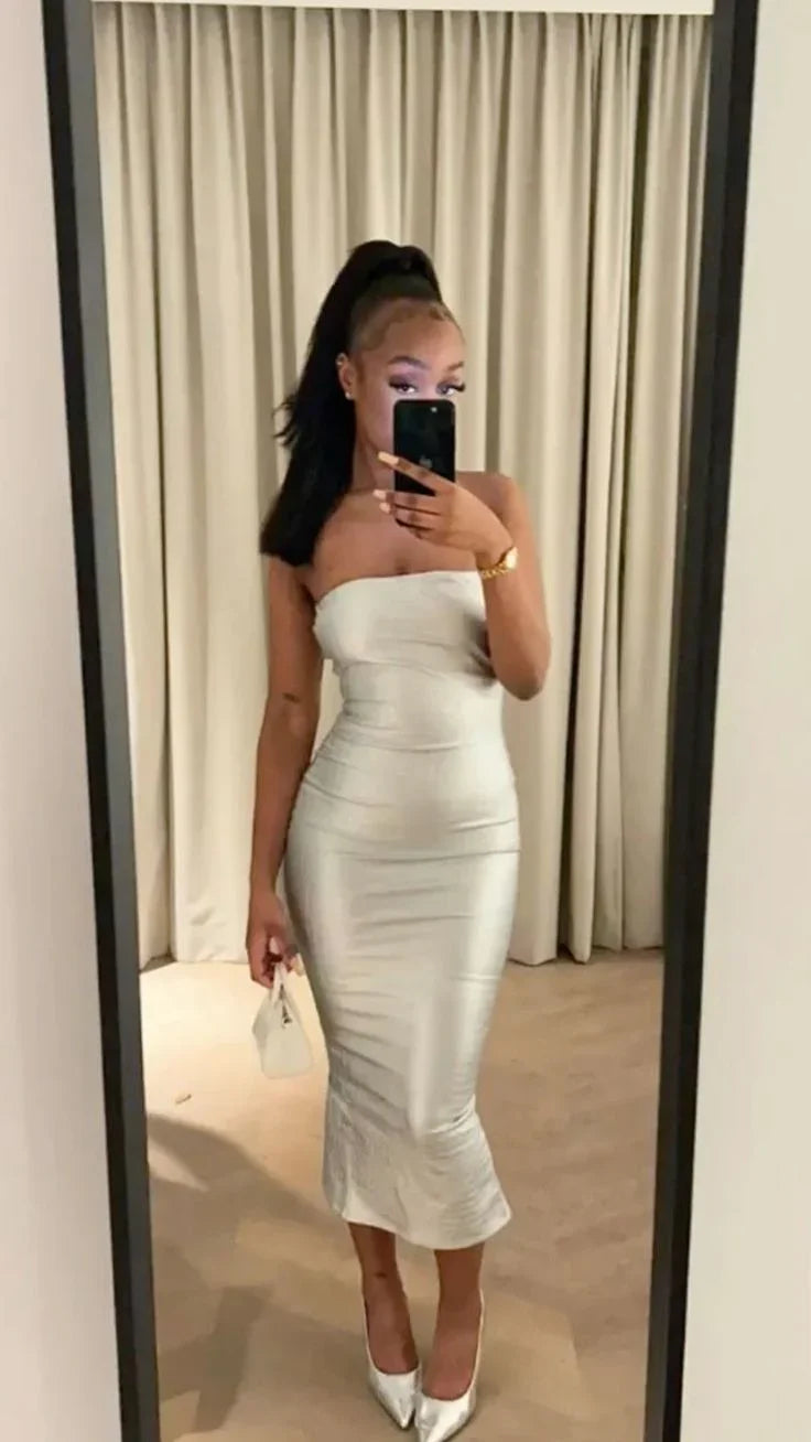 Woman wearing a strapless silver bodycon midi dress and heels, taking mirror selfie at ZAPDRESS