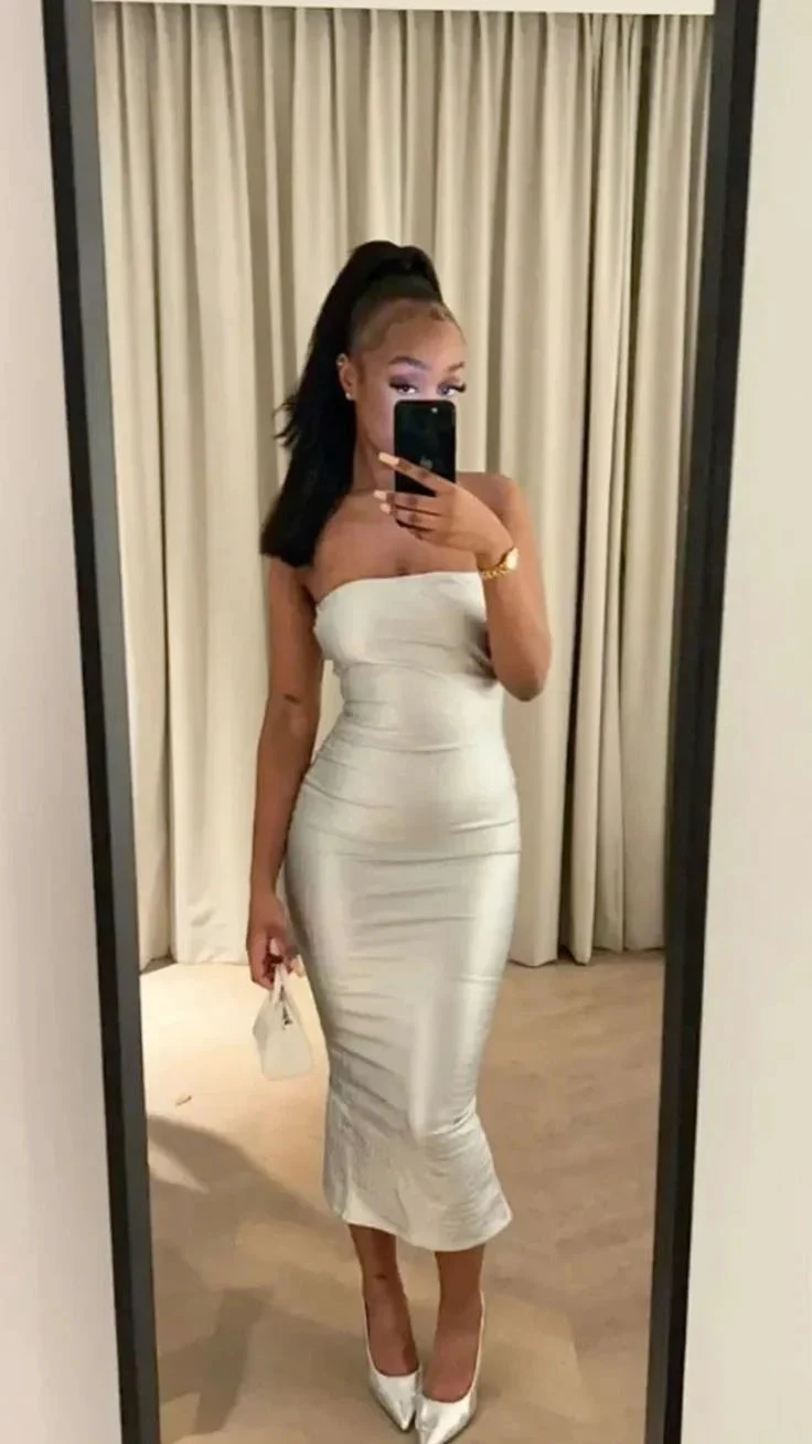 Woman taking mirror selfie in strapless silver dress and heels, ZAPDRESS elegant fashion