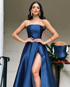 Woman in elegant strapless navy satin evening dress with lace-up back from ZAPDRESS