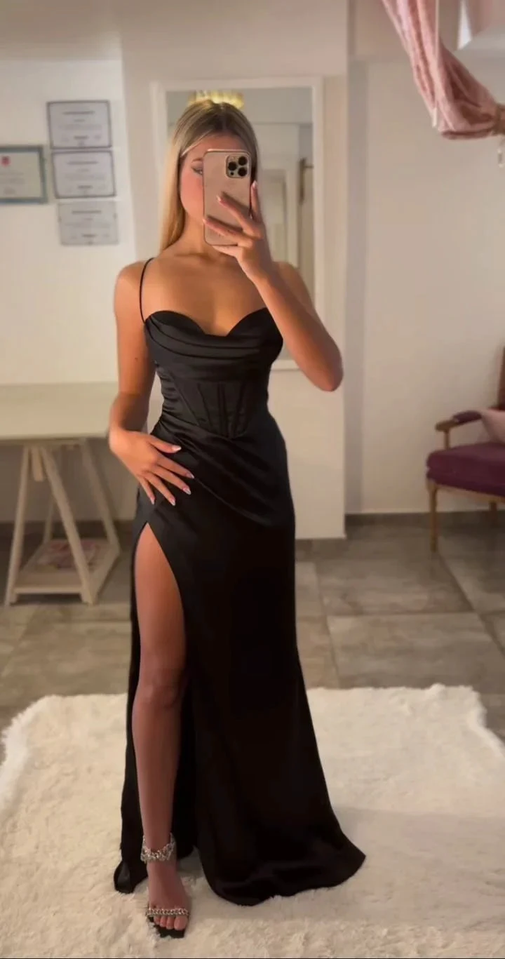Woman taking mirror selfie in chic black satin evening dress with thigh slit from ZAPDRESS