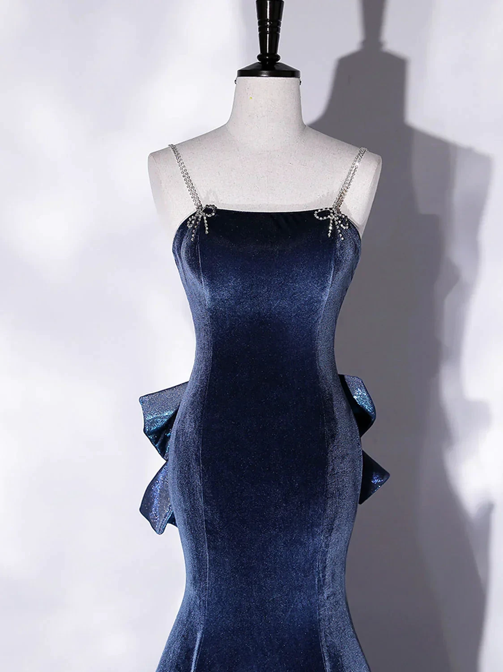Elegant navy blue velvet dress with jeweled straps on mannequin at ZAPDRESS