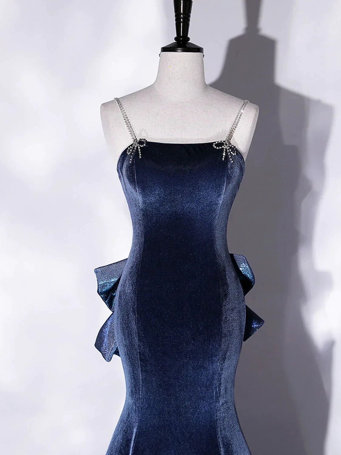 Elegant navy blue velvet dress with jeweled straps on mannequin at ZAPDRESS