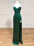 Emerald green evening gown with corset bodice and high slit on mannequin at ZAPDRESS