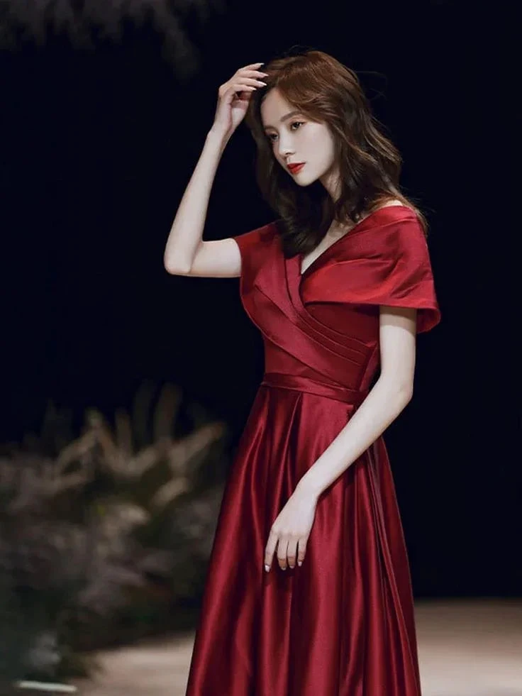 Woman in elegant red satin evening dress, ZAPDRESS fashion collection