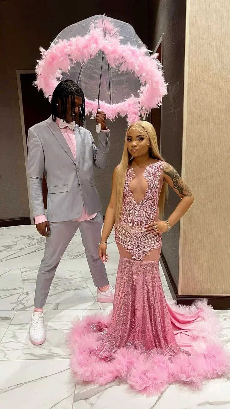 Couple in formalwear, woman in pink sequin feather gown, man in gray suit, ZAPDRESS style