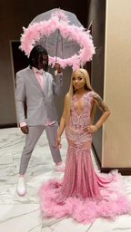 Couple in formalwear, woman in pink sequin feather gown, man in gray suit, ZAPDRESS style