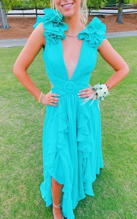 Woman in turquoise ruffle dress with deep V-neck at outdoor event on grass, ZAPDRESS style