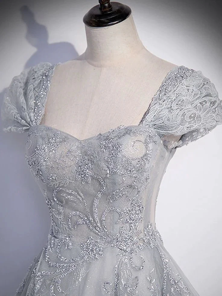 Elegant silver sequin embroidered dress on mannequin from ZAPDRESS