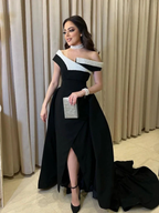 Elegant woman in a black and white off-shoulder evening gown with jeweled accessories, ZAPDRESS