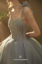 Ethereal Dusty Blue Sweetheart Tulle Ball Gown with Beaded Bodice & Bow Accents by ZAPDRESS