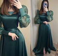 Woman wearing emerald green satin long dress with sheer puff sleeves, ZAPDRESS fashion