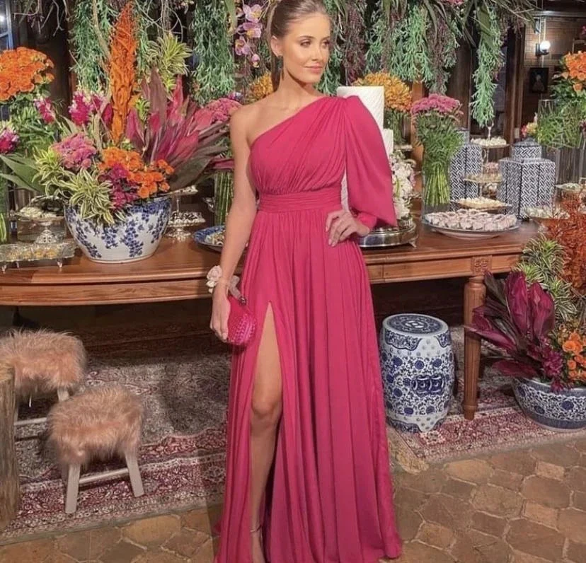 Woman in elegant pink one-shoulder dress from ZAPDRESS at floral event setting