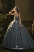 Ethereal Dusty Blue Sweetheart Tulle Ball Gown with Beaded Bodice & Bow Accents by ZAPDRESS