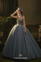 Ethereal Dusty Blue Sweetheart Tulle Ball Gown with Beaded Bodice & Bow Accents by ZAPDRESS