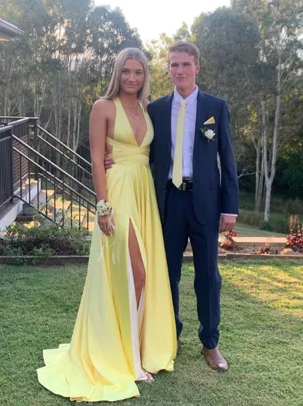 Woman in yellow evening gown and man in suit at outdoor event, ZAPDRESS fashion