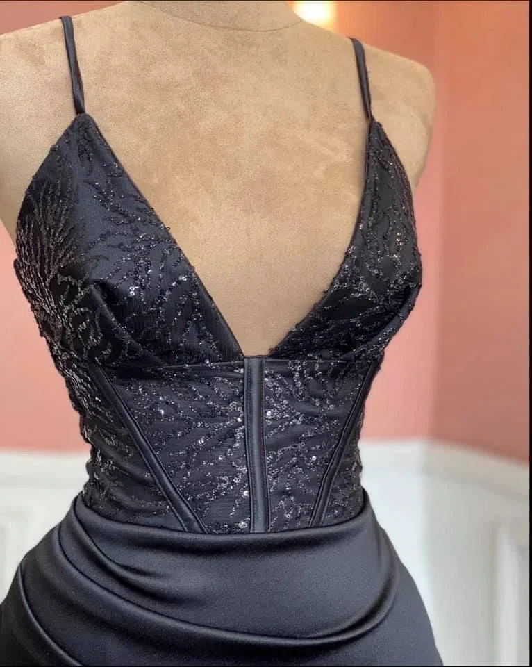 Elegant black sequin evening dress with deep V-neck on mannequin, ZAPDRESS fashion