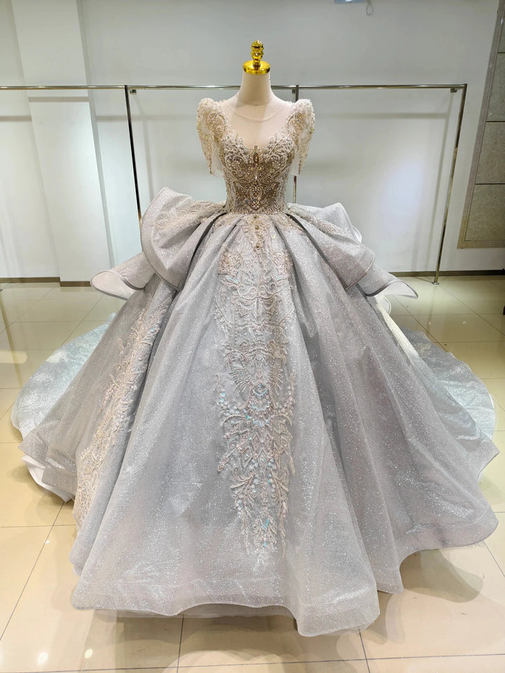 Silver Glimmer V-Neck Ballgown: Crystal-Embroidered Bust &amp; Dramatic Bow Train by ZAPDRESS