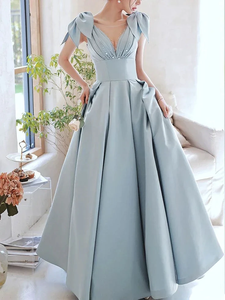 Elegant light blue evening gown with bows on shoulders, pleated skirt; ZAPDRESS fashion style