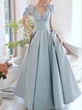 Elegant light blue evening gown with bows on shoulders, pleated skirt; ZAPDRESS fashion style