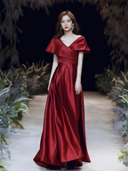 Woman in elegant red satin evening gown on a runway, ZAPDRESS formal dress fashion