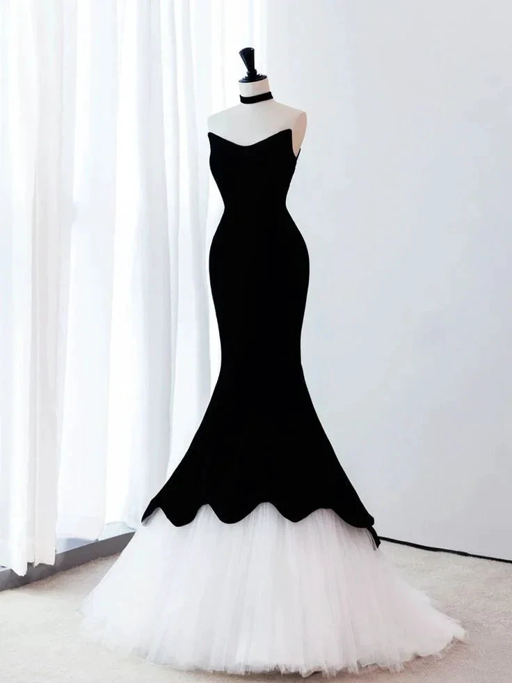 Elegant black and white mermaid gown on mannequin in bright room, ZAPDRESS fashion