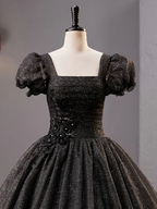 Elegant black glitter dress with puff sleeves and floral details on mannequin, ZAPDRESS