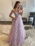 Woman in a lavender lace off-shoulder gown taking a mirror selfie at ZAPDRESS boutique