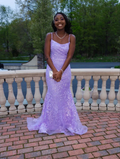 Smiling woman in a lilac sequin gown standing outdoors, ZAPDRESS formal dress style