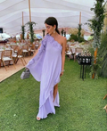 Woman in a lavender one-shoulder dress at an outdoor garden event, ZAPDRESS fashion