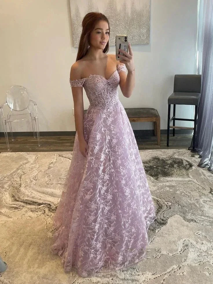 Woman wearing lavender off-shoulder lace prom dress taking mirror selfie at ZAPDRESS store