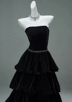 Elegant strapless black tiered evening dress on mannequin, ZAPDRESS fashion
