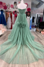 Elegant mint green tulle evening gown with floral waist details on display at ZAPDRESS boutique